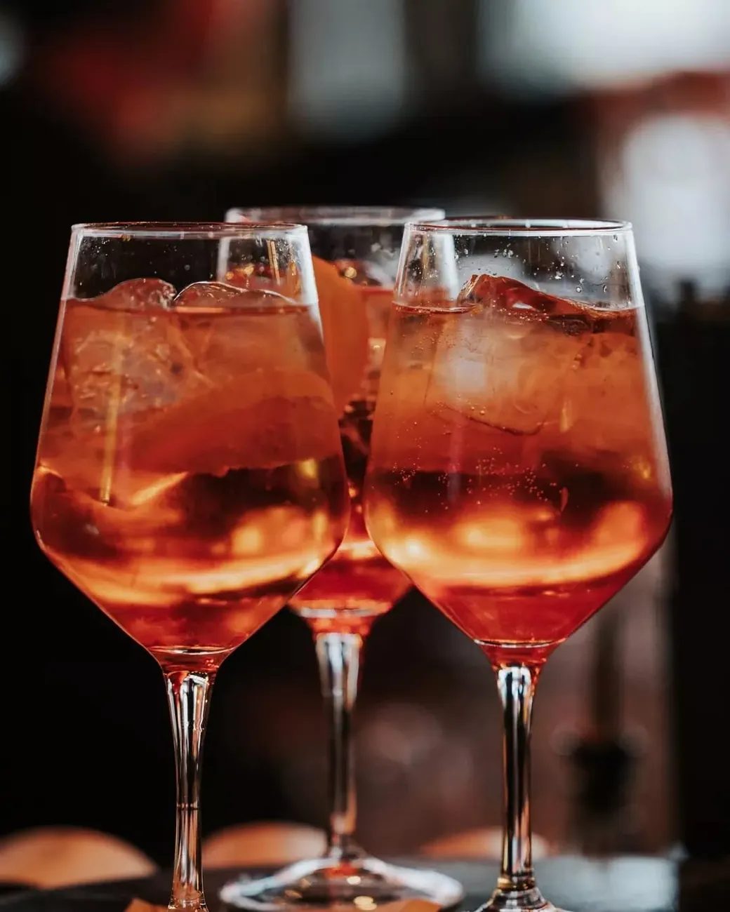 Three spritz cocktails on the bar